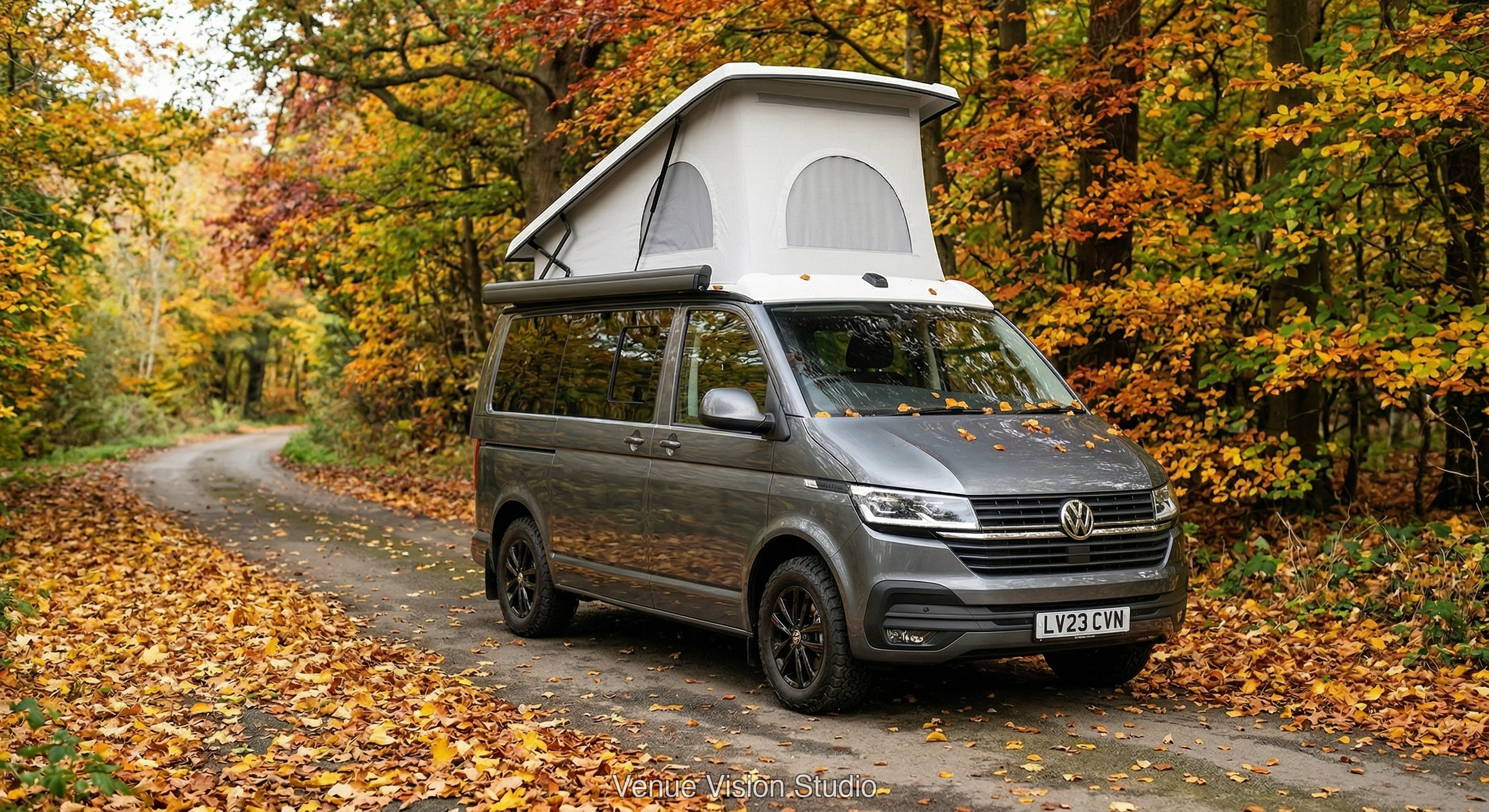 Campervan in autumn woodland